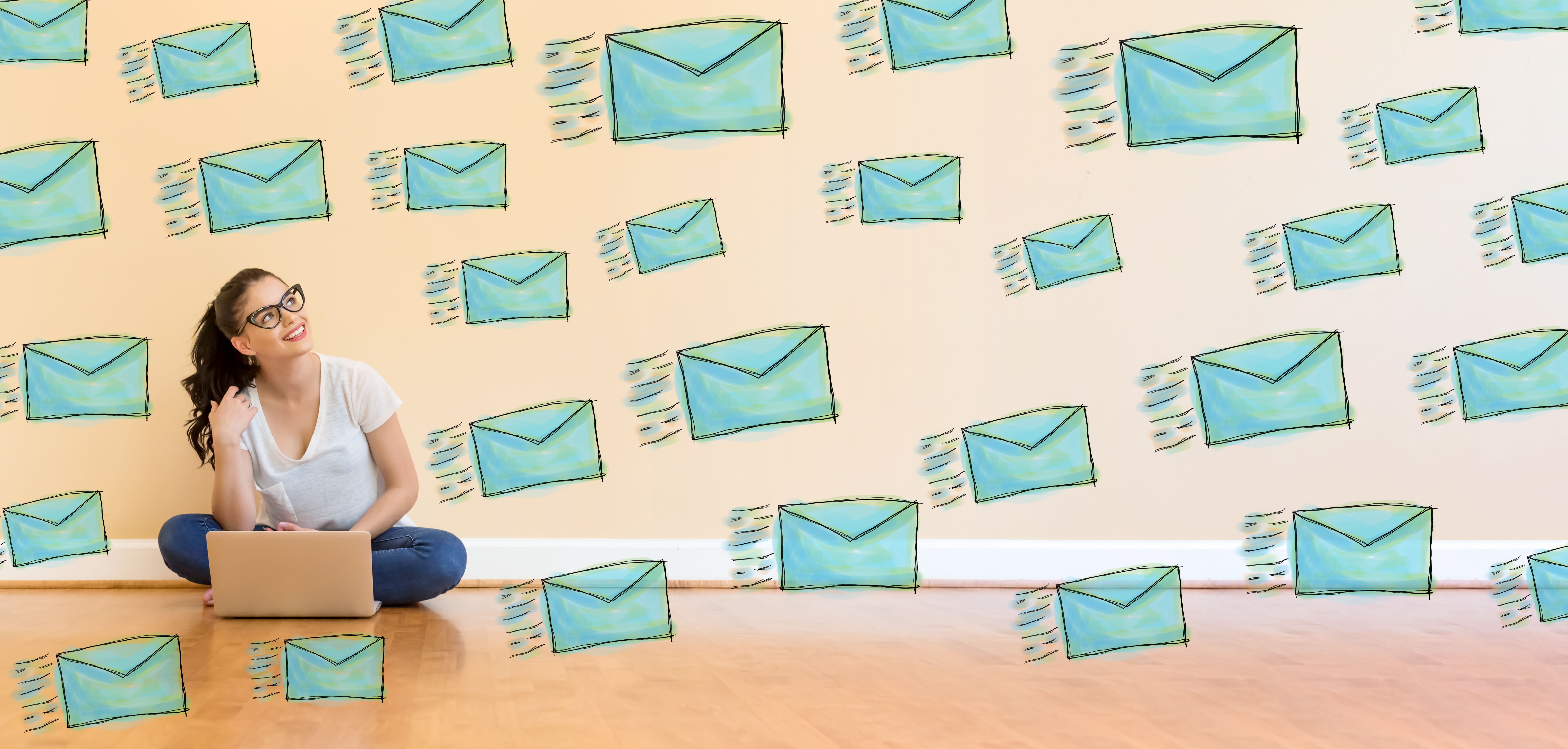 Young woman with a laptop surrounded by flying envelopes